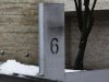 A stand of a postbox that was damaged due to a small explosion is seen in front of house of Glencore CEO Glasenberg in Rueschlikon near Zurich