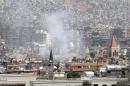 A view shows smoke rising after mortar bombs landed on a neighborhood in Damascus