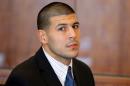 In this Oct. 9, 2013 file photo, former New England Patriots NFL football player Aaron Hernandez attends a pretrial court hearing in Fall River, Mass. Hernandez is due in court Wednesday, May 28, 2014 to be arraigned on murder charges for allegedly ambushing and gunning down two men in 2012 after a chance encounter inside a Boston nightclub. (AP Photo/Brian Snyder, Pool, File)
