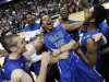 Florida Gulf Coast's Sherwood Brown, center, celebrates with teammates after their 81-71 win over San Diego State in a third-round game in the NCAA college basketball tournament, Sunday, March 24, 2013, in Philadelphia. Florida Gulf Coast became the first No. 15 seed to make the Sweet 16. (AP Photo/Michael Perez)