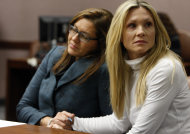 FILE - This Nov. 27, 2012 file photo shows attorney Ellen Torregrossa-O'Connor, left, holding the hand of former "Melrose Place" actress Amy Locane-Bovenizer, 40, of Hopewell Township, N.J. as the jury in her trial returns a verdict in Somerville, N.J. Locane-Bovenizer, who was driving drunk when her SUV plowed into a car and killed a New Jersey woman, was sentenced Thursday, Feb. 14, 2013, to three years in prison. (AP Photo/The Star-Ledger, Robert Sciarrino, filel)