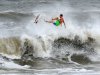 A surfer kicks out at the top of a wave after a ride, Saturday Oct. 27, 2012 in Jacksonville, Fla. Hurricane Sandy, upgraded again Saturday just hours after forecasters said it had weakened to a tropical storm, was barreling north from the Caribbean and was expected to make landfall early Tuesday near the Delaware coast, then hit two winter weather systems as it moves inland, creating a hybrid monster storm.   (AP Photo/The Florida Times-Union, Bob Mack)
