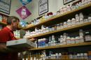 A man stocks shelves with vitamins and diet supplements on April 6, 2009 at a store in San Francisco, California