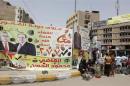 An election poster of Mahmoud Al- Hassan of Prime Minister Nuri al-Maliki's State of Law coalition for the start of election campaign in Baghdad