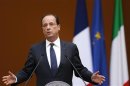 French President Hollande gestures during a news conference with Italian Prime Minister Mario Monti at Chigi palace in Rome