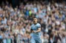 Manchester City's Sergio Aguero celebrates after scoring his third goal against Tottenham during the English Premier soccer match between Manchester City and Tottenham Hotspur at the Etihad Stadium, Manchester, England, Saturday Oct. 18, 2014. (AP Photo/Jon Super)
