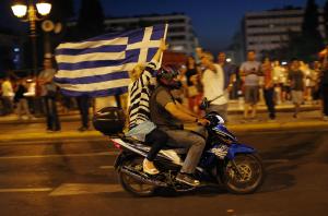 A supporter of the No vote waves a Greek flag after &hellip;