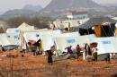 File photo shows displaced Yemenis at a camp set up by the United Nations High Commissioner for Refugees (UNHCR) in Mazraq in Yemen's Hajja region, 360 kms northwest of Sanaa, on September 10, 2009