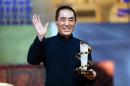 Chinese director Zhang Yimou receives an award on December 2, 2012 during the 12th Marrakesh International Film Festival in Morocco