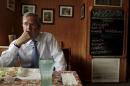 U.S. Republican presidential candidate Jeb Bush listens to a question during an interview with Reuters at Nonie's Restaurant in Peterborough