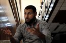 Youssef Jihani, senior member of Ansar al-Shariah Brigades, speaks to the Associated Press during an interview, in Benghazi, Libya, Sept. 18, 2012. Ansar al-Shariah is among the most powerful of the many, heavily armed militias that the government relies on to keep security in Benghazi. Jihani, denied the group took part in the attack. "We never approve of killing civilians, especially those who helped us," he said the day after the attack. (AP Photo/Mohammad Hannon)