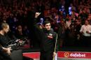 England's Ronnie O'Sullivan reacts after winning the frame to win the matchin the Masters Snooker final at Alexandra Palace in north London on January 17, 2016