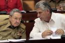 Cuba's President Raul Castro, left, and Vice President Miguel Diaz-Canel attend the opening of a twice-annual legislative sessions, at the National Assembly in Havana, Cuba, Friday, Dec. 20, 2013. (AP Photo/Cubadebate, Ismael Francisco)