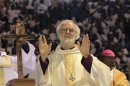 Head of Anglican Church, Archibishop of Canterbury Rowan Williams, greets people upon his arrival in a church service in the capital Harare