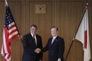 U.S. Secretary of Defense Panetta shakes hands with Japan's Minister of Defense Morimoto in Tokyo