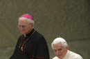 Pope Benedict XVI is flanked by Cardinal-designate James M. Harvey as he applauds during a meeting with the "Santa Cecilia" association, at the Vatican, Saturday, Nov. 10, 2012. Latin is being resurrected at the Vatican. Pope Benedict XVI issued a decree Saturday creating a new pontifical academy for Latin studies to try to boost interest in the official language of the Roman Catholic Church that is nevertheless out of widespread use elsewhere. Benedict acknowledged Latin's fall from grace, saying future priests nowadays often learn only a "superficial" appreciation of Latin in seminaries. The new academy, which is part of the Vatican's culture office, will promote Latin through conferences, publications and instruction in Catholic schools, universities and seminaries. (AP Photo/Alessandra Tarantino)