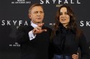 Cast members Craig and Marlohe pose for photographers during a photocall to promote their film "Skyfall" in Berlin