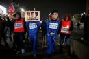 People march during a protest calling for South Korean President Park Geun-hye to step down in central Seoul