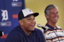 Detroit Tigers first baseman Miguel Cabrera shares a laugh with Tigers President, CEO and General Manager David Dombrowski during a news conference where the details of Cabrera's eight-year contract extension was officially announced in Lakeland, Fla., Friday, March 28, 2014. (AP Photo/Carlos Osorio)