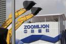 File photo of Zoomlion company logo next to its excavators at an exhibition in Shanghai