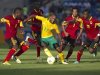 South Africa's Parker dribbles the ball past Angola's Dede, Pirolito, Lunguinha and Bastos during their African Nations Cup Group A soccer match in Durban