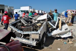 People survey a destroyed car in Ciudad Acuna, Mexico &hellip;
