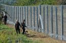 In a bid to stem the influx, Hungary sealed its Croatian border with a razor-wire fence early Saturday, barely a month after it shut its frontier with Serbia