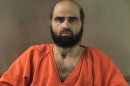 FILE - This undated file photo provided by the Bell County Sheriff's Department shows Maj. Nidal Hasan. Hasan has been convicted of murder for the 2009 shooting rampage at Fort Hood that killed 13 people and wounded more than 30 others. Hasan and many of his victims seem to want the same thing - his death. But while survivors and relatives of the dead view lethal injection as justice, the Army psychiatrist appears to see it as something else - martyrdom. (AP Photo/Bell County Sheriff's Department, File)
