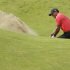 Tiger Woods of the United States hits the ball out of the bunker on the sixth hole on his second attempt at Royal Lytham & St Annes golf club during the final round of the British Open Golf Championship, Lytham St Annes, England Sunday, July  22, 2012. (AP Photo/Peter Morrison)