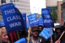 Protesters demonstrate against British payday loan company 'Wonga' in central London, on May 1, 2014