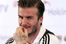 Los Angeles Galaxy's David Beckham reacts during a news confrence in Jakarta