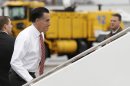 Republican presidential candidate, former Massachusetts Gov. Mitt Romney boards his campaign plane at Toledo Express Airport in Toledo, Ohio, Friday, Oct. 26, 2012, as he travels to a campaign stop in Des Moines, Iowa. (AP Photo/Charles Dharapak)
