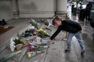 A young boy leaves flowers in tribute to victims of&nbsp;&hellip;