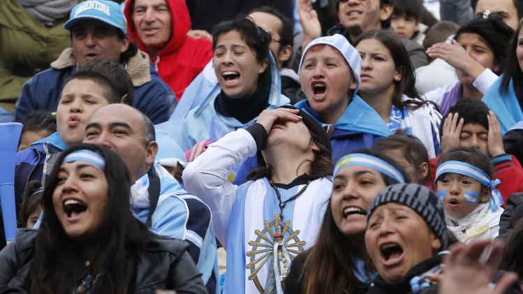 Argentina soccer fans react as they watch a broadcast of the team&#39;s 2014 World Cup soccer match against Iran, in Buenos Aires