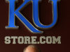 Paul Vander Tuig, trademark licensing director at Kansas University, pose for a photograph by the gift store at Allen Fieldhouse in Lawrence, Kan. With the launch of the first public sale of .xxx domains, Kansas University has purchased .xxx domains to protect its school and brand from being linked to pornographic sites. (AP Photo/Ed Zurga)