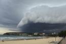 A wave-like cloud looms over Sydney's Manly Beach during an afternoon storm front