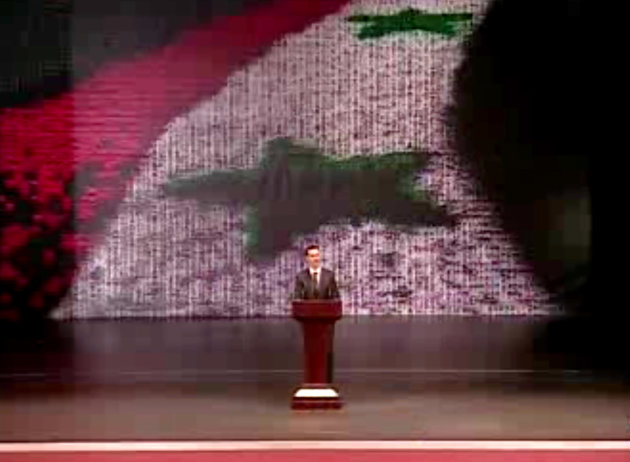 In this image taken from video obtained from Syrian State Television, which has been authenticated based on its contents and other AP reporting, Syrian President Bashar Assad speaks at the Opera House in central Damascus, Syria, Sunday, Jan. 6, 2013. Syrian President Bashar Assad on Sunday outlined a new peace initiative that includes a national reconciliation conference and a new government and constitution but demanded regional and Western countries stop funding and arming rebels first. (AP Photo/Syrian State Television via AP video)