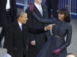 President Barack Obama and first lady Michelle Obama wave during the inaugural parade in Washington