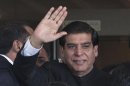 Pakistan's Prime Minister Ashraf waves after arriving at the Supreme Court in Islamabad