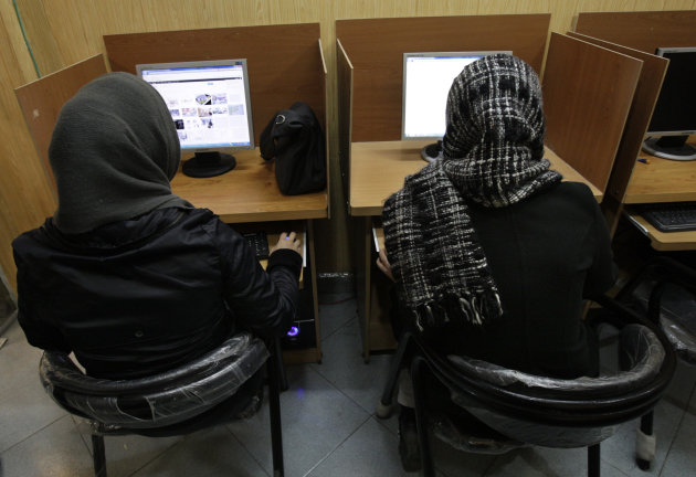 <p>               FILE- In this Monday, Feb. 13, 2012 file photo, Iranian women use computers at an Internet cafe in central Tehran. Iran’s cyber monitors often tout their efforts to fight the West’s 'soft war' of influence through the web, but trying to ban Google’s popular Gmail may have gone too far with complaints coming even from email-starved parliament members. (AP Photo/Vahid Salemi, File)