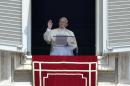 Pope Francis greets the crowd from the window of his apartments during the Sunday's Angelus prayer at St Peter's Square on July 20, 2014 at the Vatican