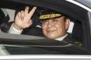 Thailand's Prime Minister Prayuth gestures to the media as he leaves after a handover ceremony for the new Royal Thai Army Chief, General Udomdej, at the Thai Army Headquarters in Bangkok