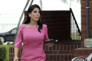 Jill Kelley leaves her home Tuesday, Nov 12, 2012 in Tampa, Fla. Kelley is identified as the woman who allegedly received harassing emails from Gen. David Petraeus' paramour, Paula Broadwell. She serves as an unpaid social liaison to MacDill Air Force Base in Tampa, where the military's Central Command and Special Operations Command are located. (AP Photo/Chris O'Meara)
