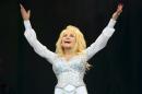 U.S singer Dolly Parton performs at Glastonbury music festival, England, Sunday, June 29, 2014. Thousands of music fans have arrived for the festival to see headliners Arcade Fire, Metallica and Kasabian. (Photo by Jonathan Short/Invision/AP)