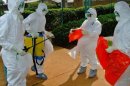WHO officials in Uganda during the latest outbreak, which the organisation said is now "under control"