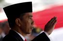 Indonesian President Joko Widodo salutes during celebrations for Indonesia's 70th Independence Day at the Presidential Palace in Jakarta