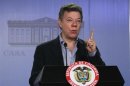 Colombia's President Santos gestures during a news conference at the Narino presidential house in Bogota