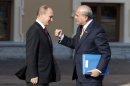 Secretary-General of the Organisation for Economic Co-Operation and Development Jose Angel-Gurria, right, gestures while speaking with Russia's President Vladimir Putin during arrivals for the G-20 summit at the Konstantin Palace in St. Petersburg, Russia on Thursday, Sept. 5, 2013. The threat of missiles over the Mediterranean is weighing on world leaders meeting on the shores of the Baltic this week, and eclipsing economic battles that usually dominate when the G-20 world economies meet. (AP Photo/Alexander Zemlianichenko)