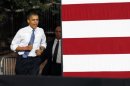 U.S. President Barack Obama jogs into a campaign rally in Las Vegas,