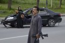 Unidentified man carries arms in Islamabad